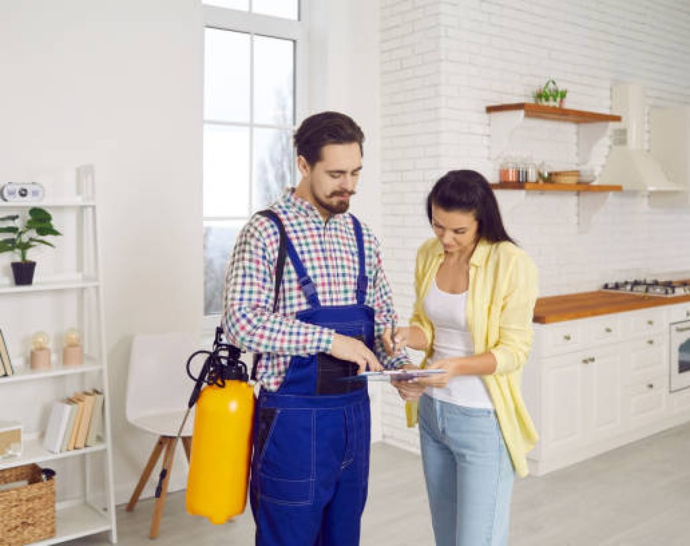Exterminator inspecting home for termites and pests in Lake Elsinore